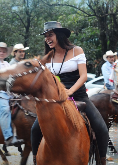 Paisa Girl riding a horse in Medellin